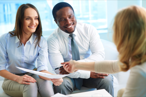 a couple going to sign an insurance contract