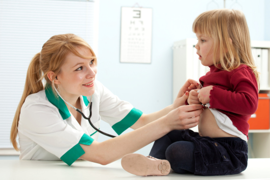 doctor pediatrician examining  little girl